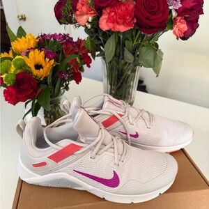 Nike Women's Light Pink Athletic Sneakers with Purple Swoosh and Coral Accents